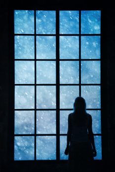 dreamstime_woman looking at snowfall