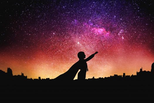 superhero silhouette at the night starry sky background. Mixed media