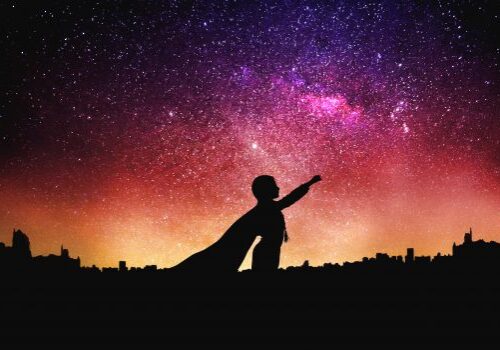 superhero silhouette at the night starry sky background. Mixed media