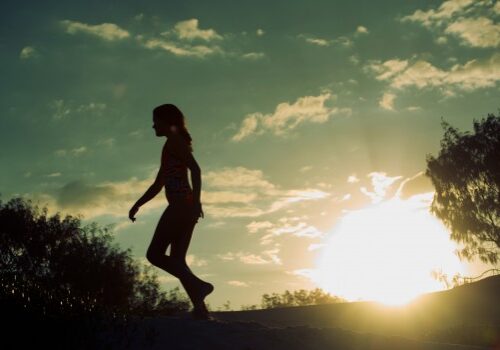 Silhouette of girls walking at sunrise Silhouette of girls walking at sunrise